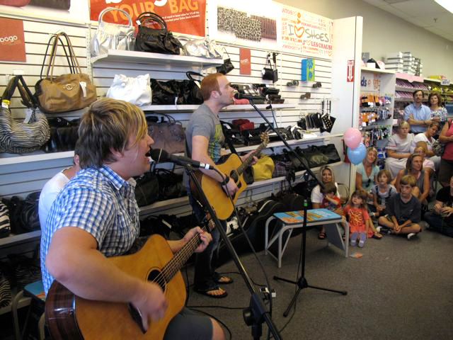 Mikeschair performs while WJIS/Sarasota, FL collects shoes at different locations