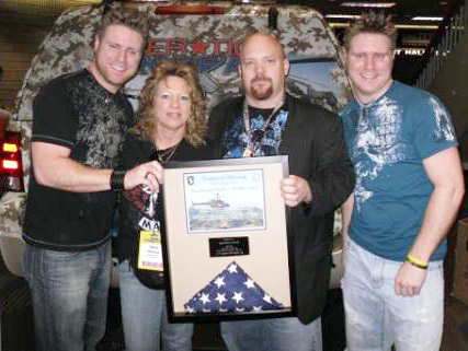 Brothers Finch receives a plaque from Operation Troop Aid