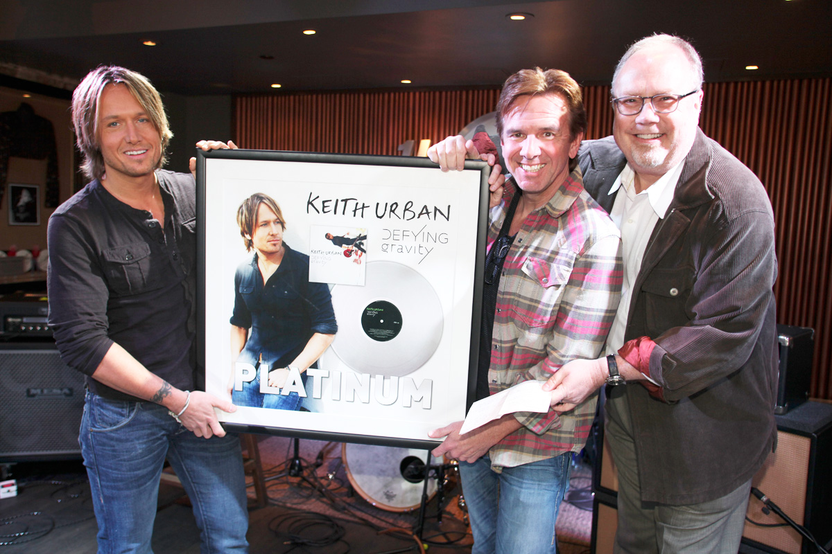 Keith Urban is surprised with a Platinum plaque