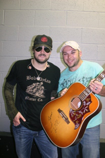 Eric Church presents fan with guitar