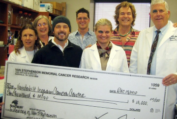 Henry Paul persents Vanderbilt Ingram Cancer Center a check