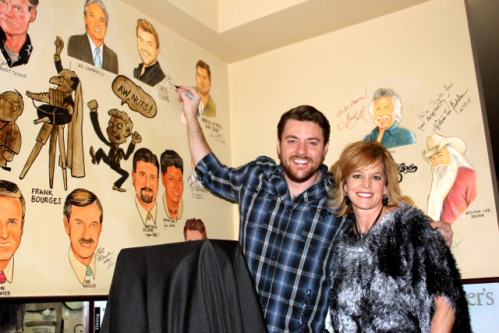 Chris Young autographs a caricature of himself
