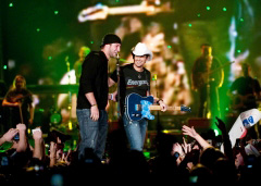 Tim Tebow on stage with Brad Paisley