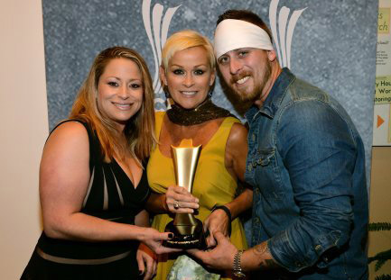Lorrie Morgan (c) and children, Morgan Whitley (L) and Jesse Keith Whitley (R),