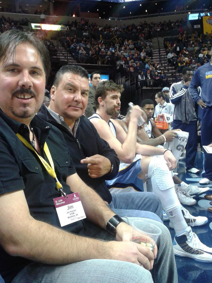 KTOM's Jim Pearson and Anthony Spencer take in a basketball game