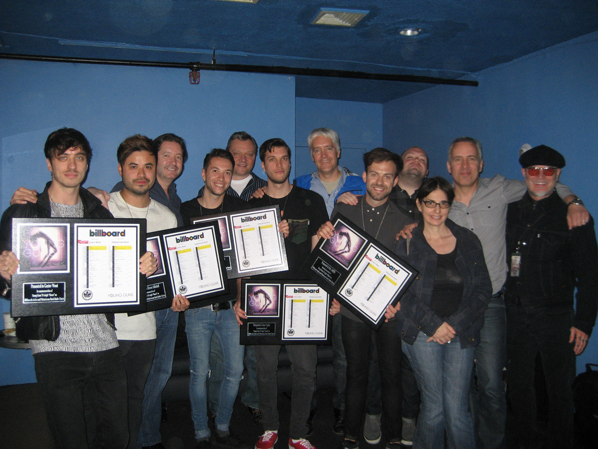 British Rockers Young Guns with plaques to commemorate their #1 Rock single