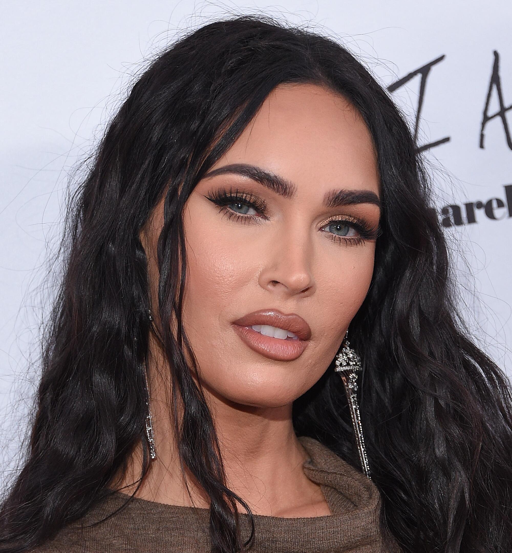 Report: Megan Fox Gets Slammed Into Barricade As Man Tries To Punch ...